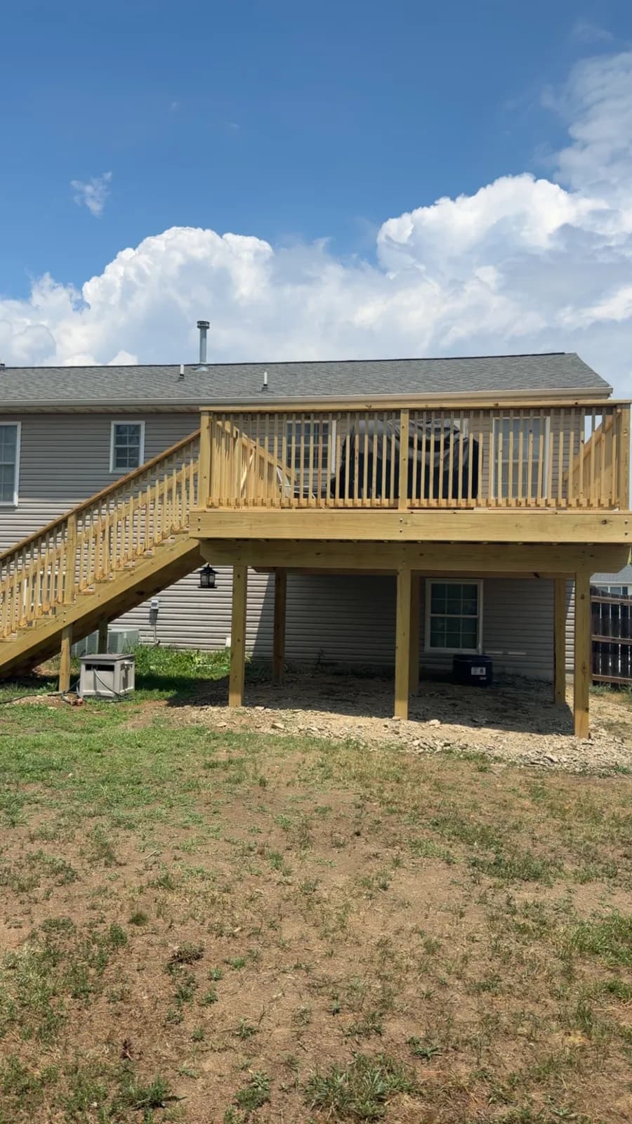 Elevated pressure-treated deck showing full post-and-beam structure