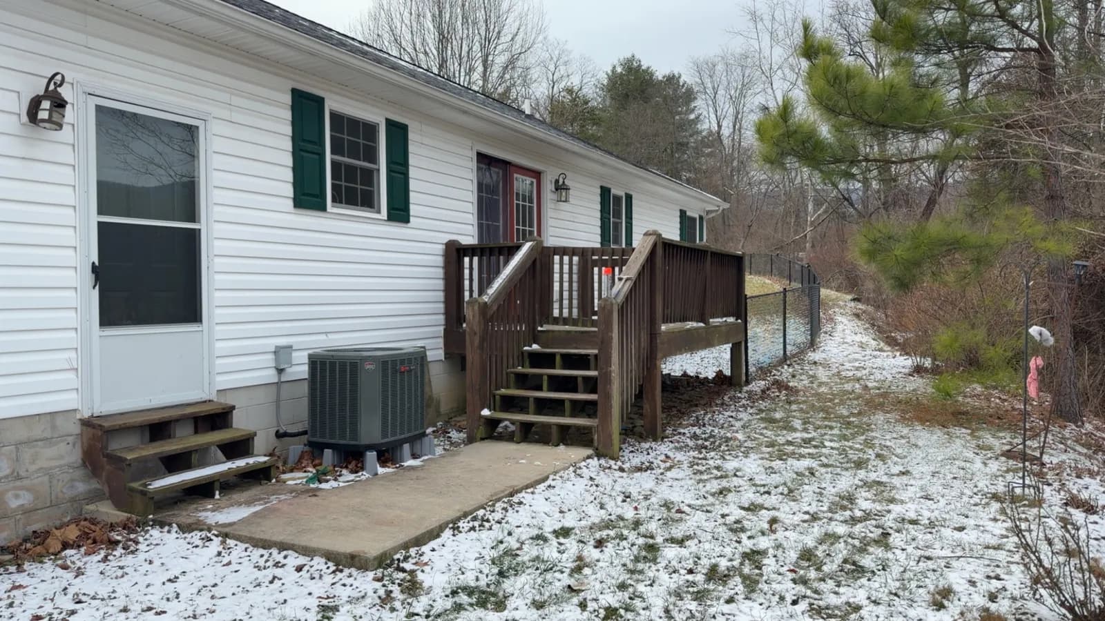 Weathered gray deck boards before cleaning and staining